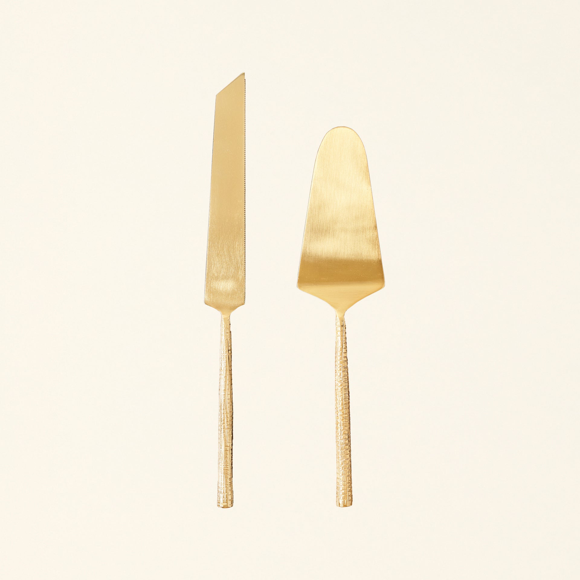 Alanis cake server set with a gold finish and textured handles.