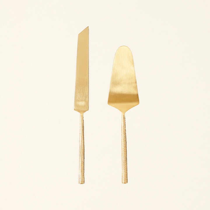 Alanis cake server set with a gold finish and textured handles.