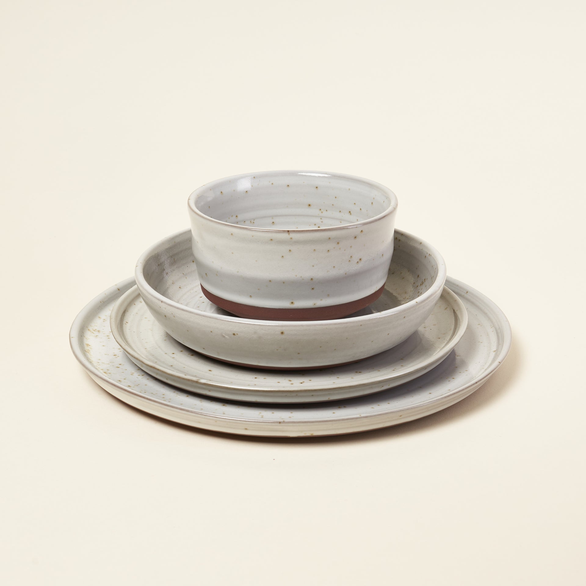 Berkley dinnerware, handmade from natural red clay with a two-toned, unglazed bottom.