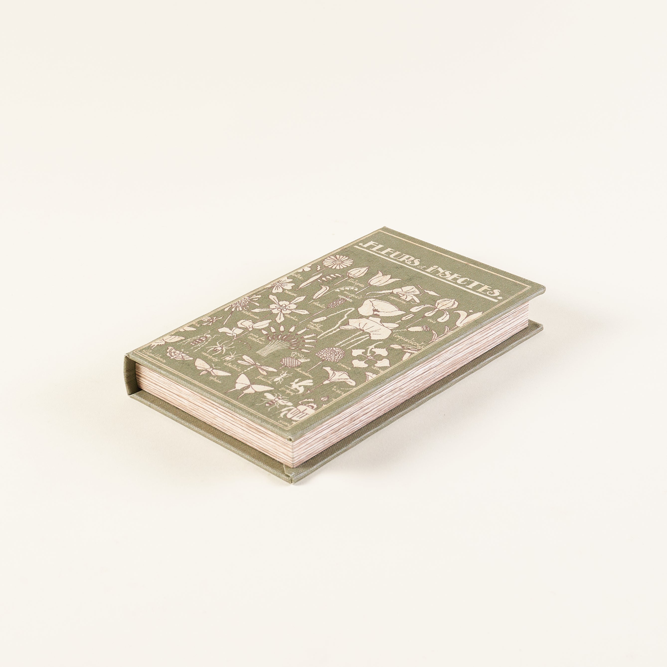 Decorative book-shaped box for storing small items.