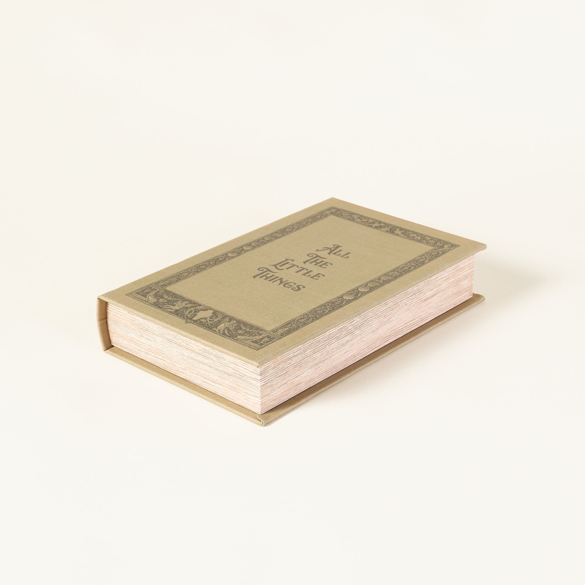 Decorative book-shaped box for storing small items.