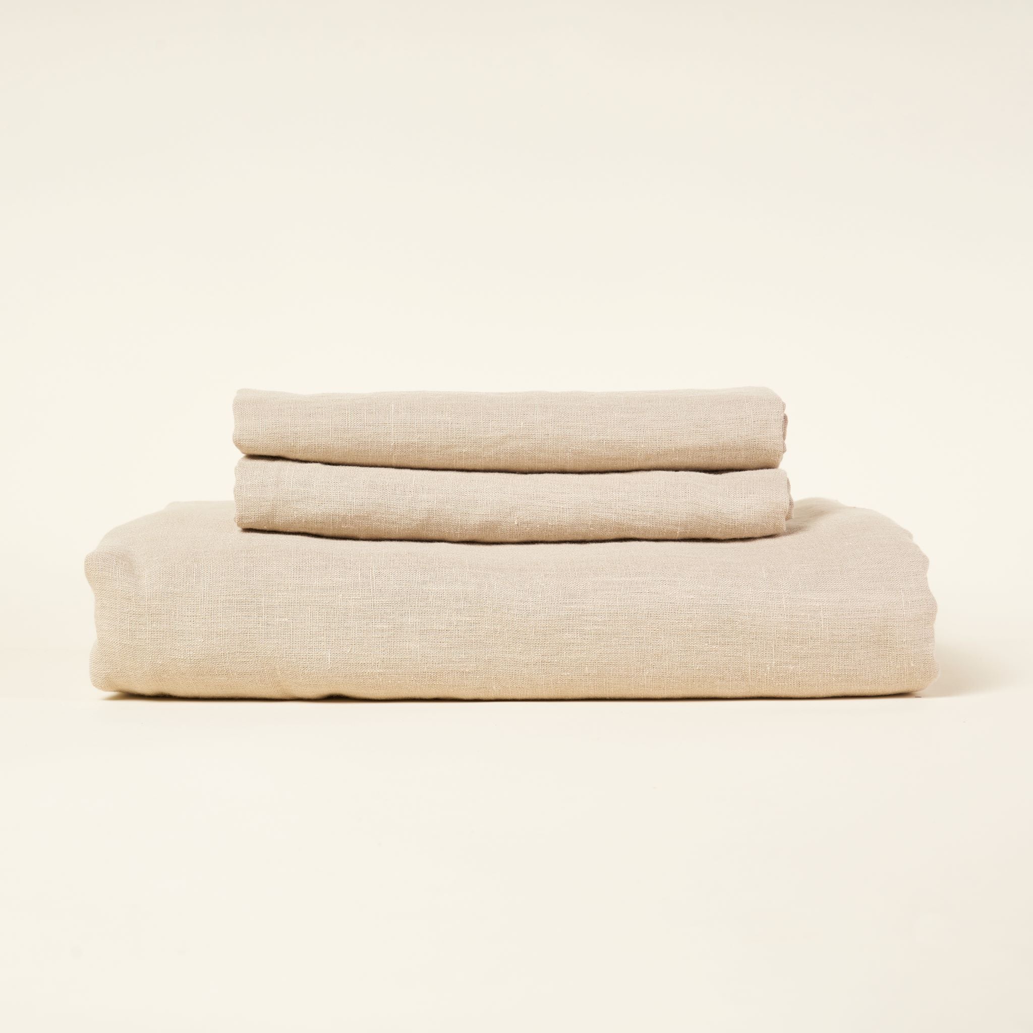 A European linen duvet cover set in a natural color with two pillowcases.