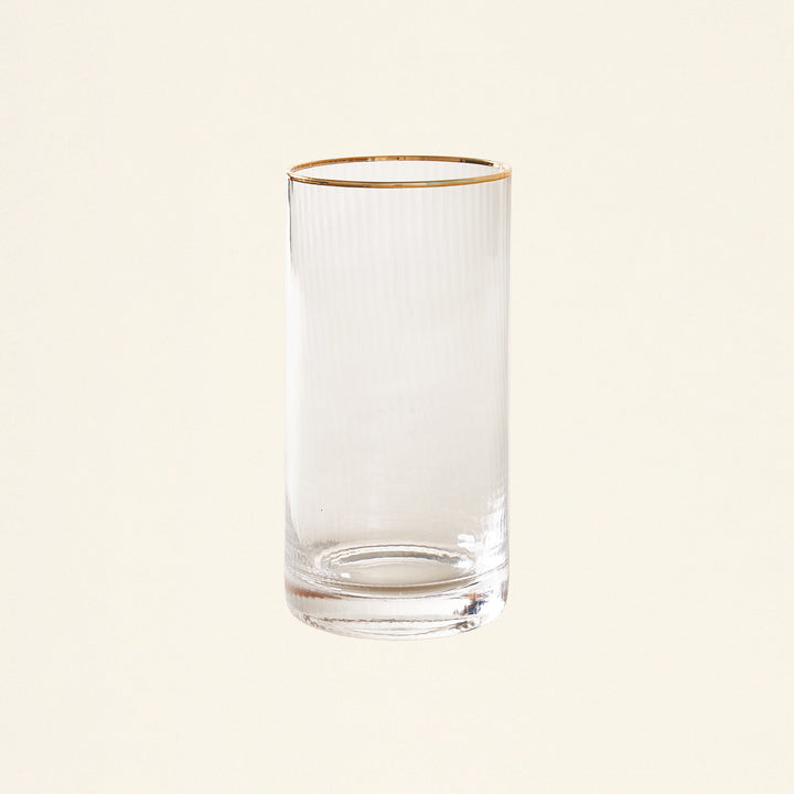Clear highball glass with a vertical optic pattern and a hand-painted gold rim.
