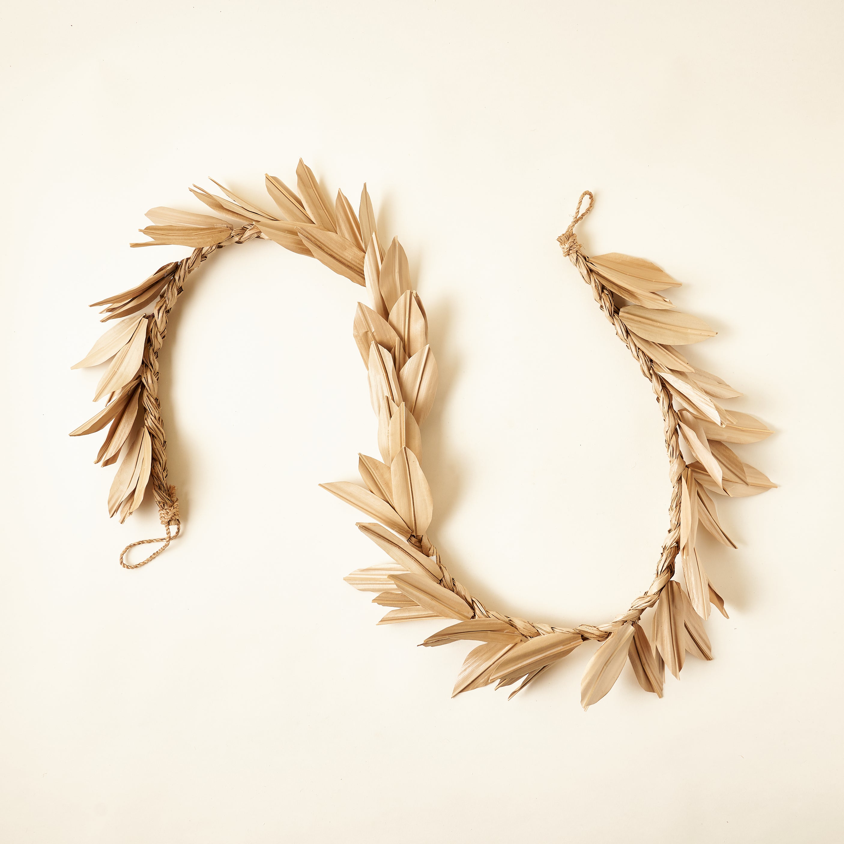 A decorative garland made from dried buri palm leaves.