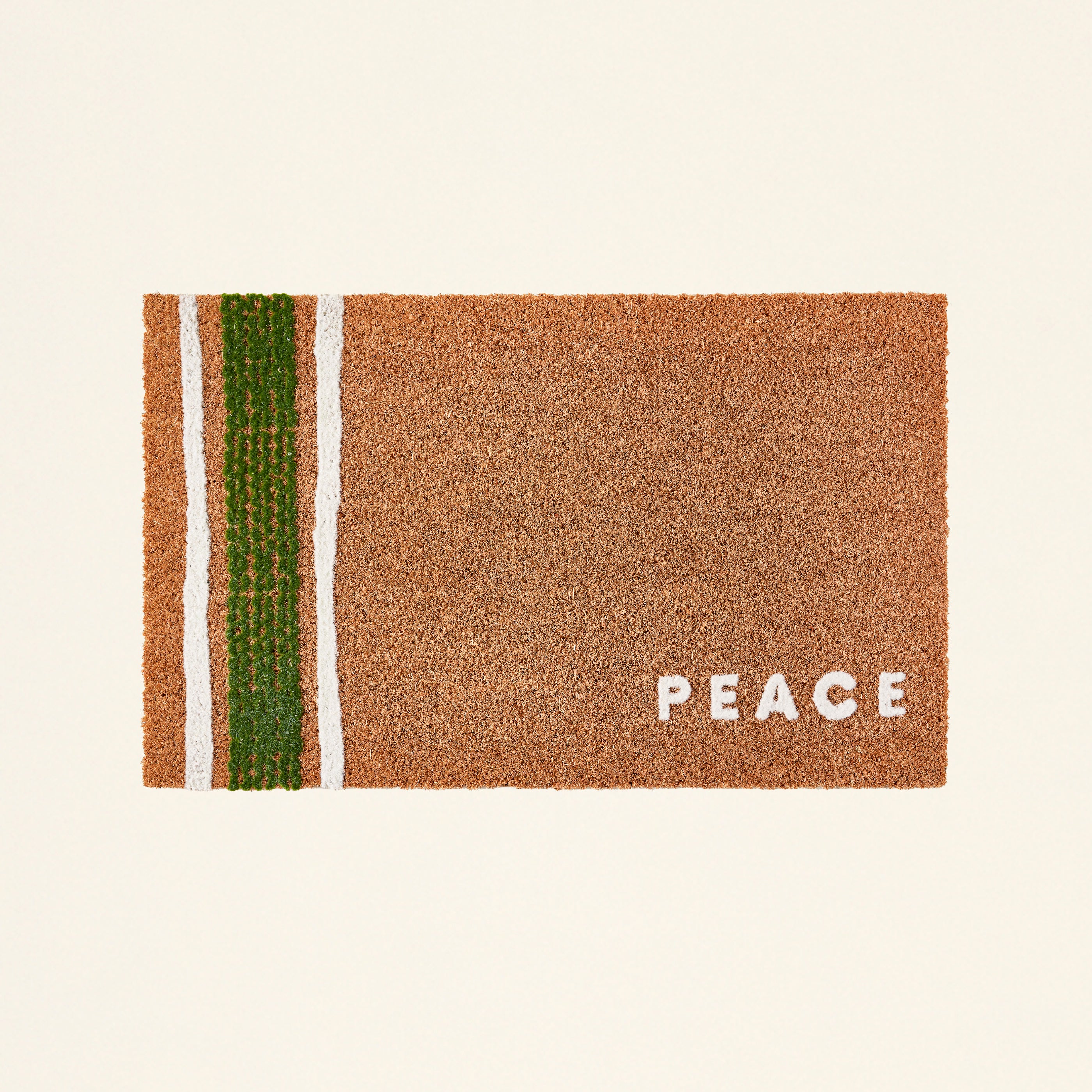 A doormat with a raised "Peace" text and a beautiful pattern.