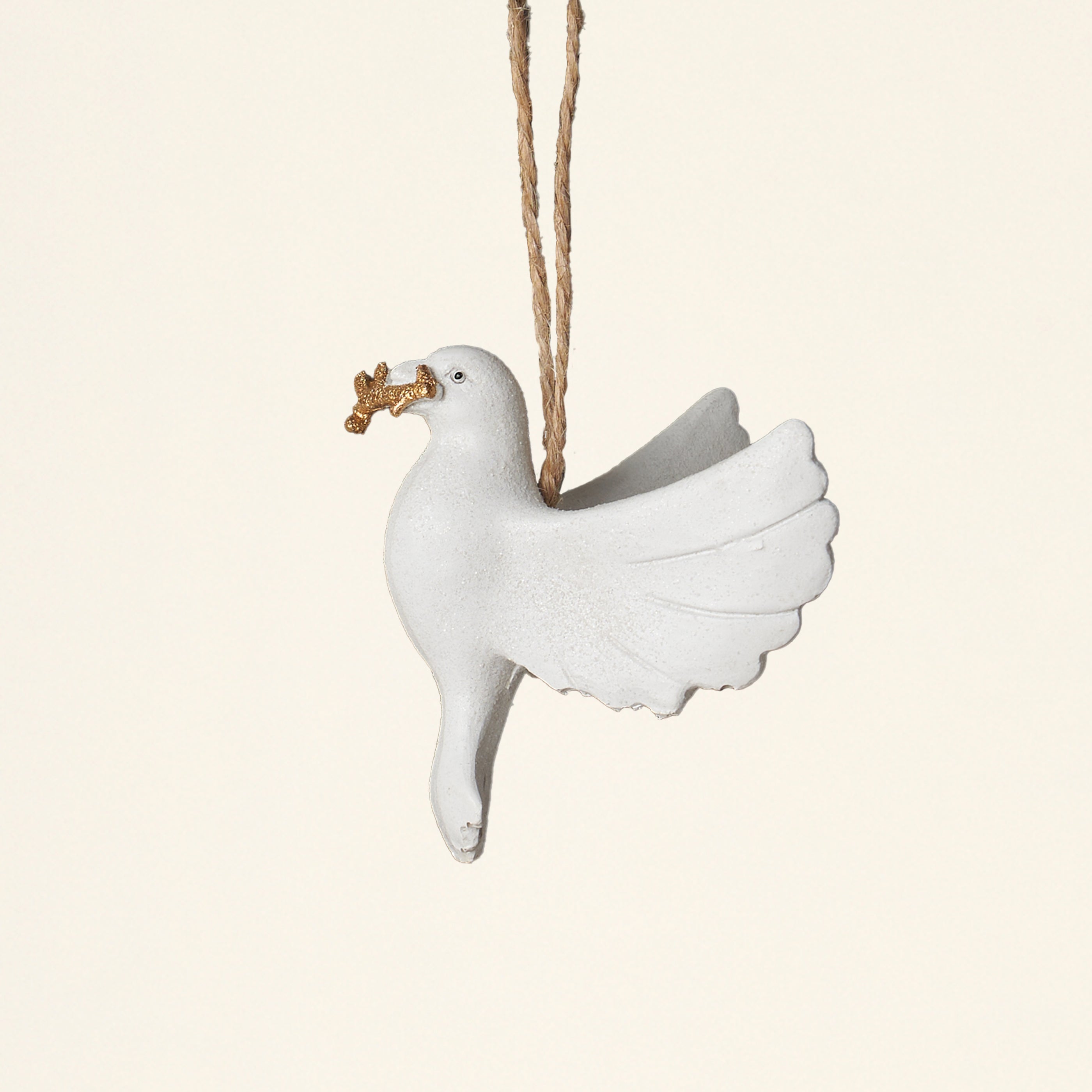 A decorative white resin dove ornament with a touch of glitter.