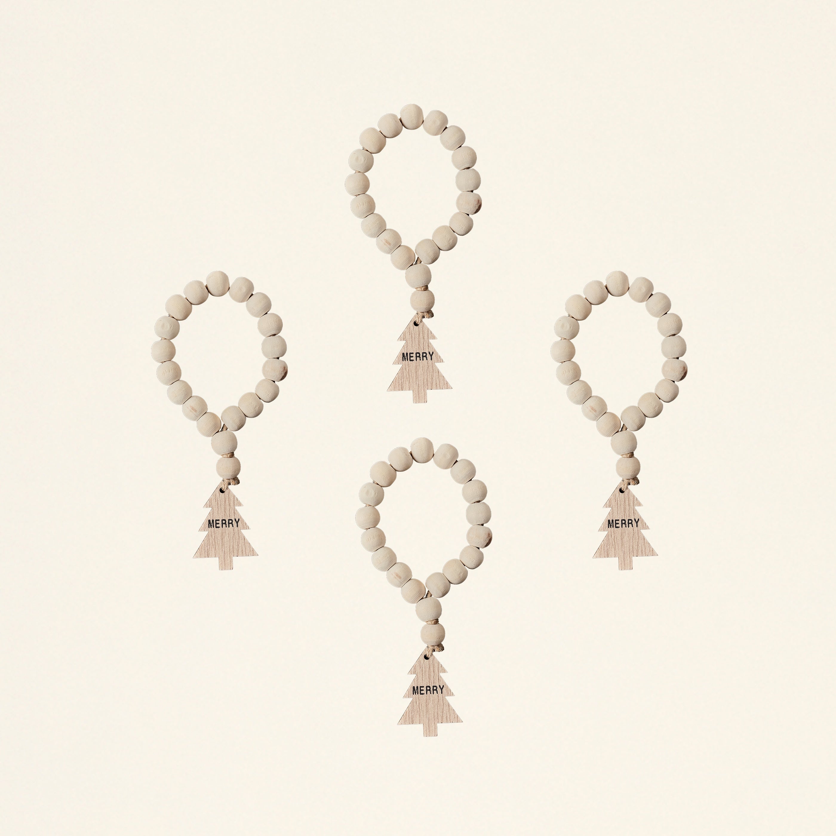 A set of four napkin rings made from wood bead garlands.
