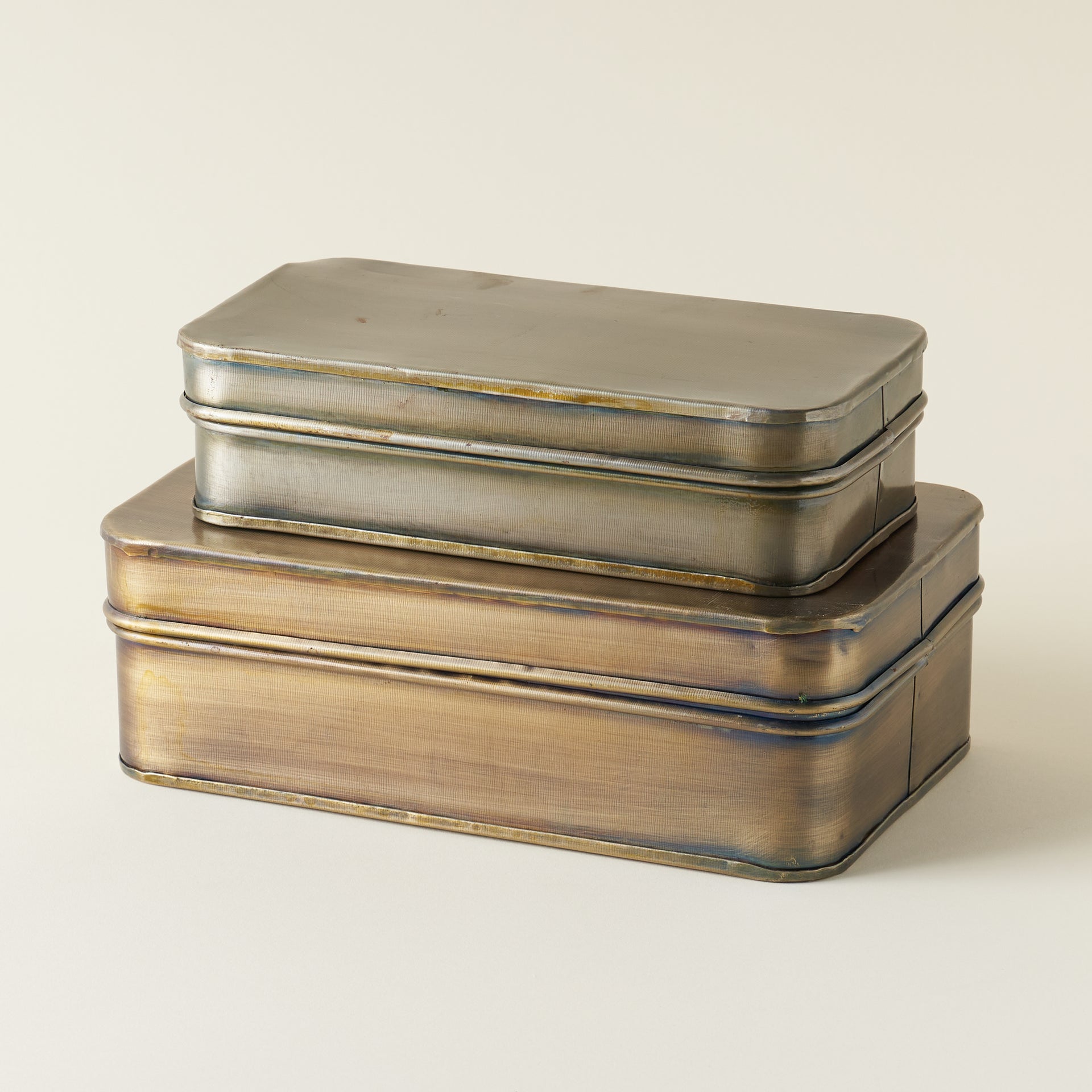 Vintage-inspired brass metal box with an antique finish, used for decorative storage.