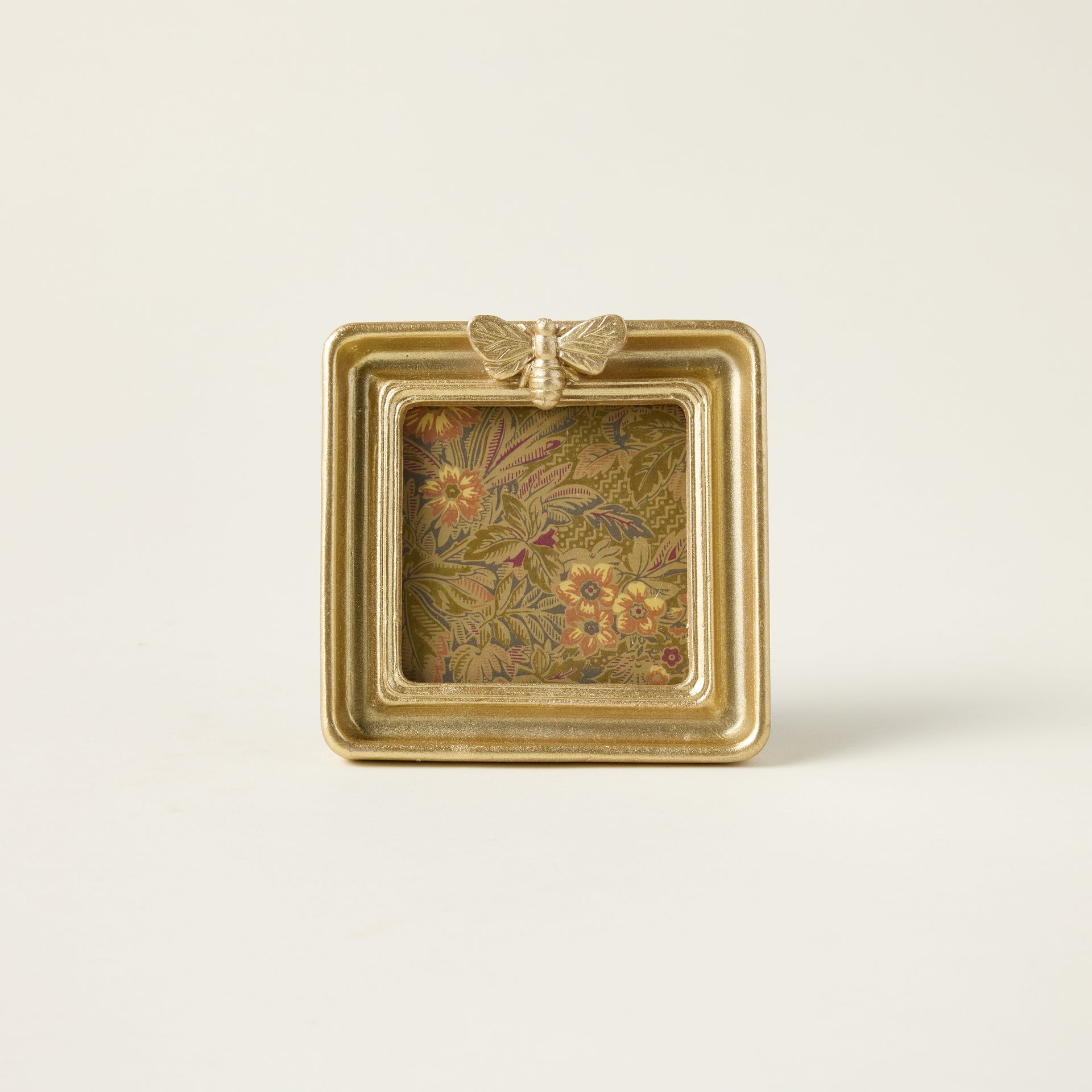 Gold bee photo frame with a sculptural bee design and an elegant, vintage-inspired finish.