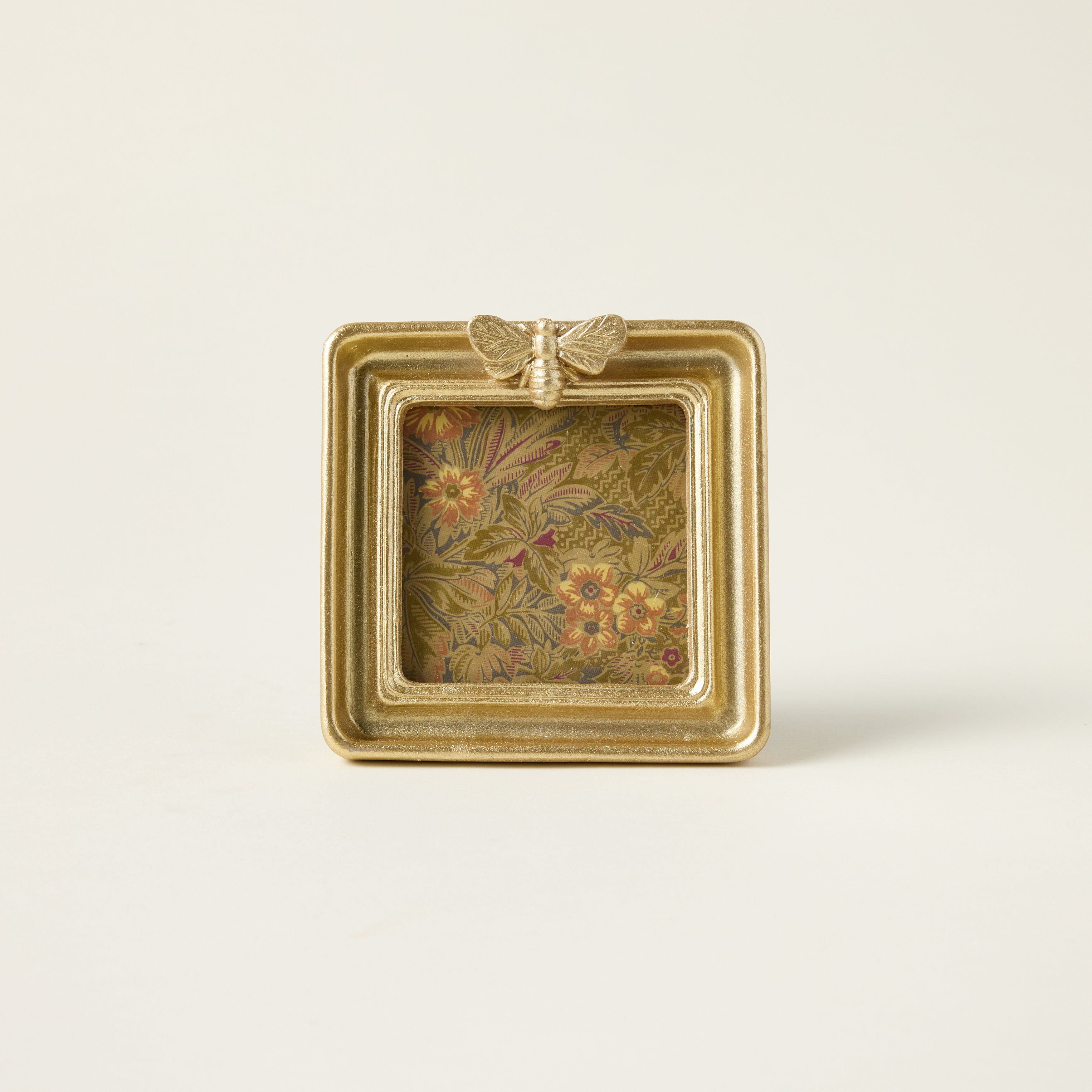 Gold bee photo frame with a sculptural bee design and an elegant, vintage-inspired finish.