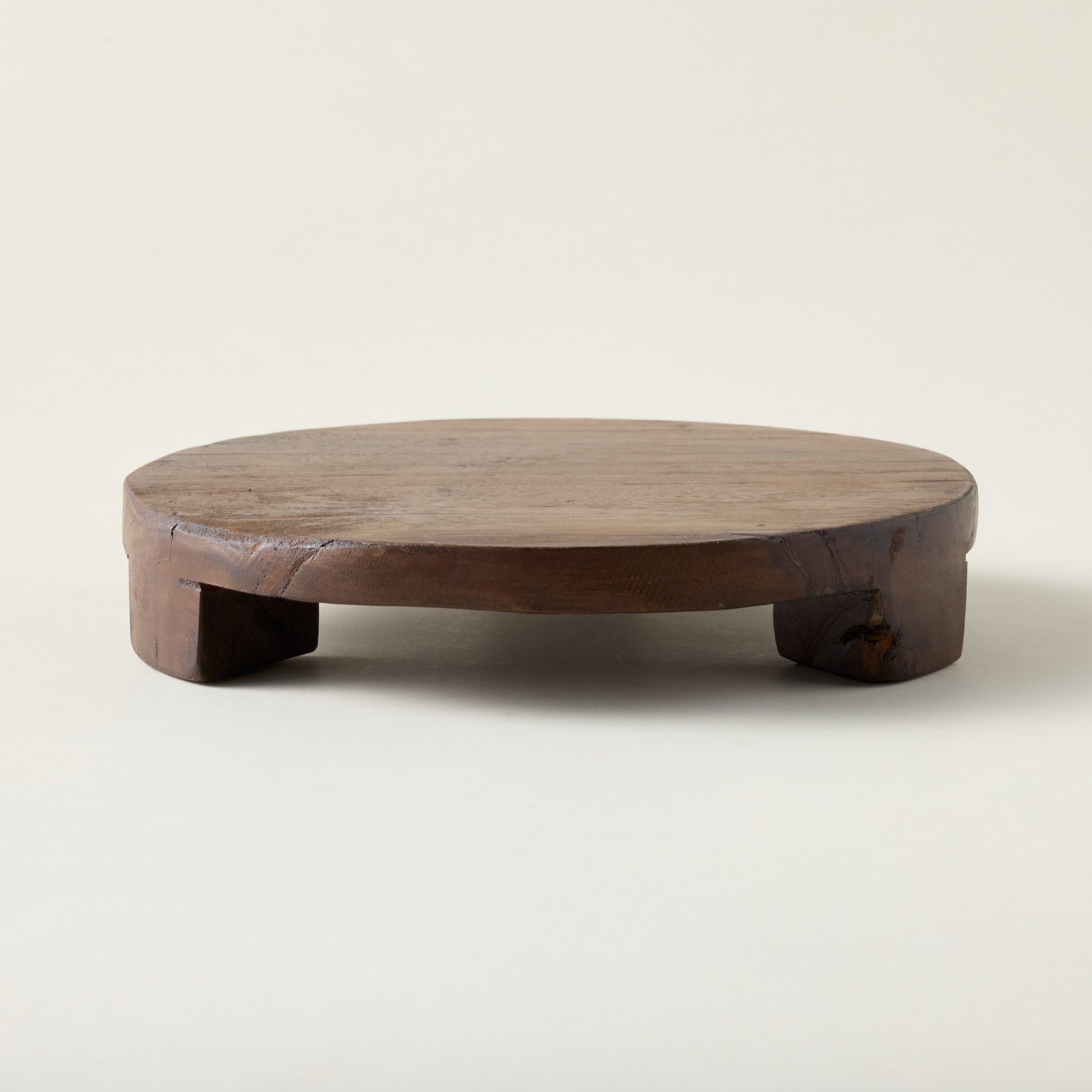 Found wood pedestal with a rustic, vintage-inspired look and a visible grain.