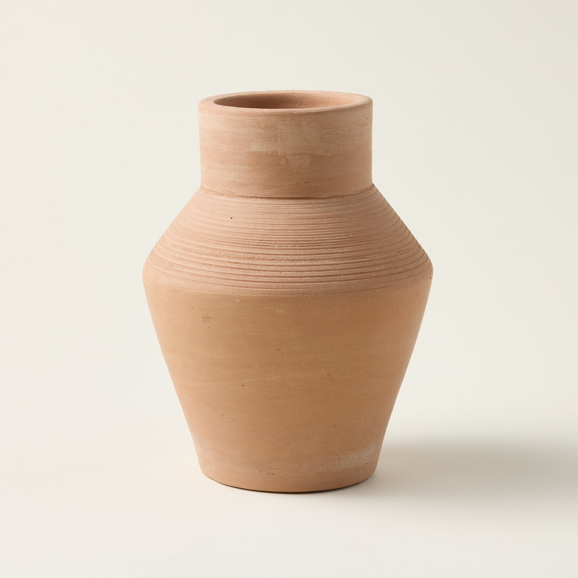 Handcrafted terracotta Freya vase with a deep earthy hue and sculptural design.