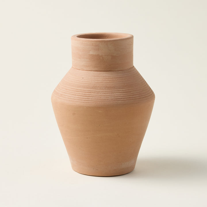 Handcrafted terracotta Freya vase with a deep earthy hue and sculptural design.