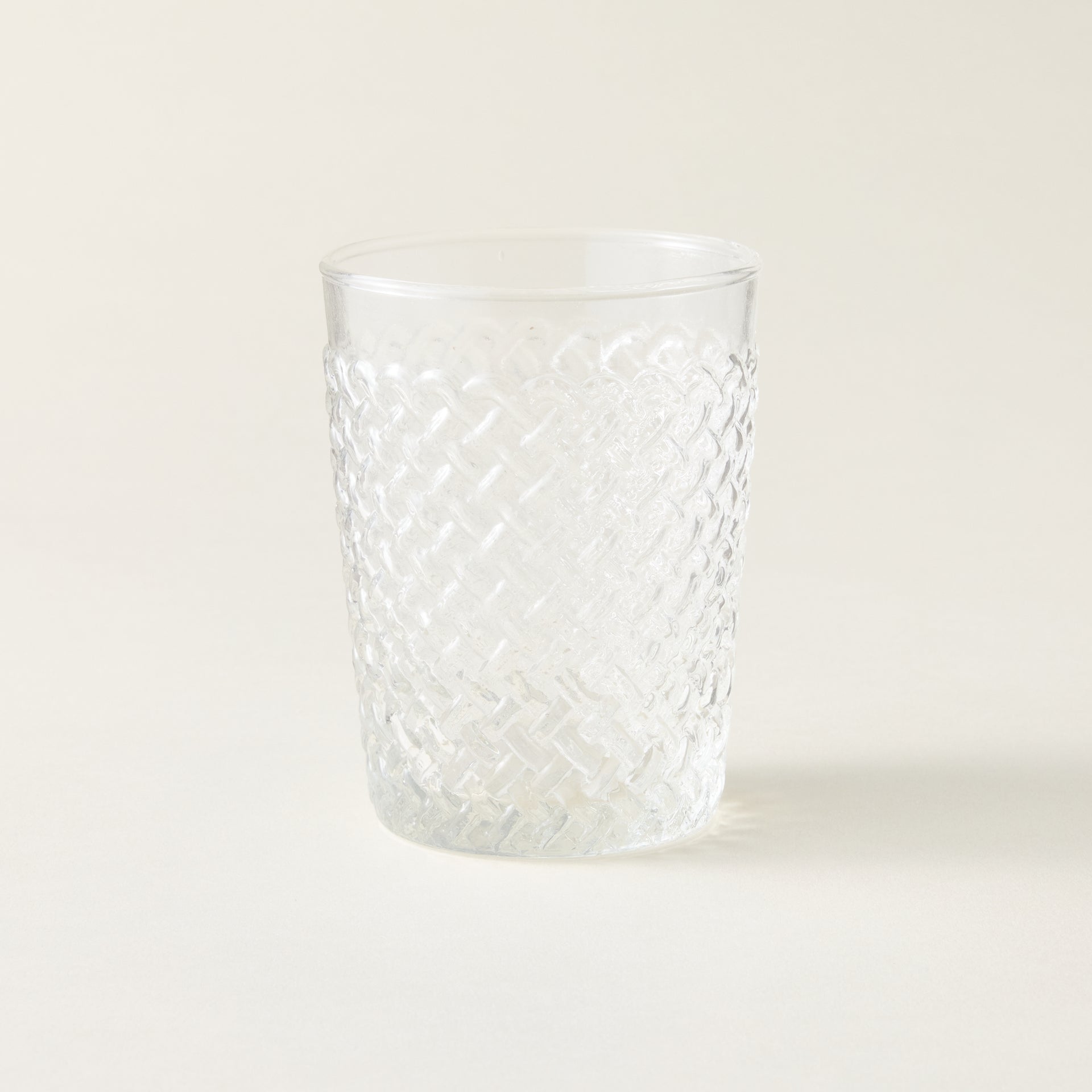 New Alt Text: Gracen tumbler with an artisanal, woven texture and a sculptural shape.