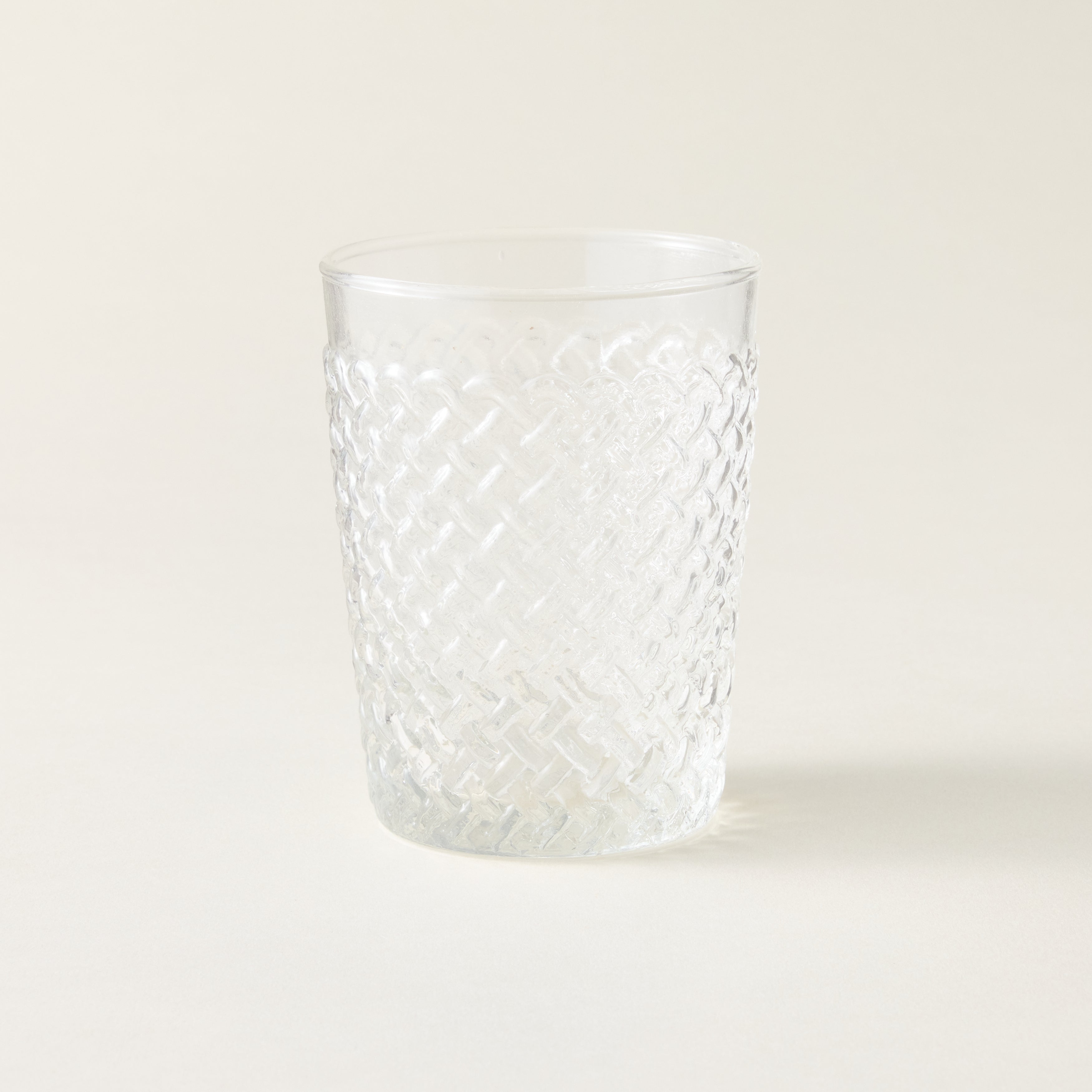 New Alt Text: Gracen tumbler with an artisanal, woven texture and a sculptural shape.