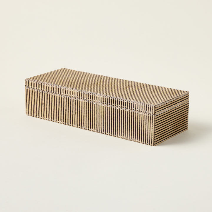 Handcrafted leather box made from genuine hair-on-hide material for decorative storage.