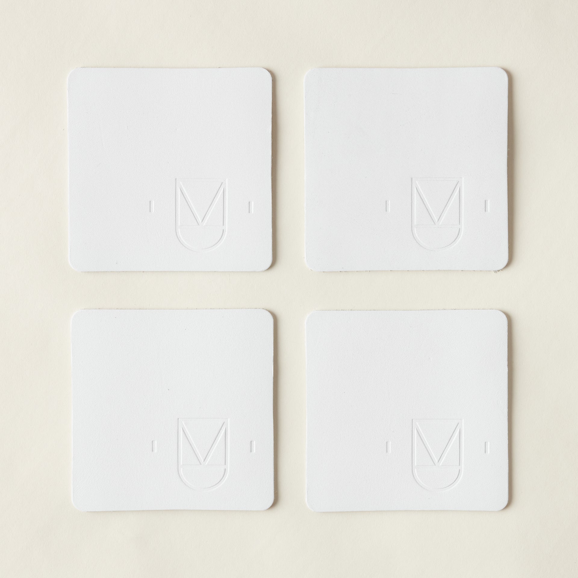 KMI White Leather Coasters Set
