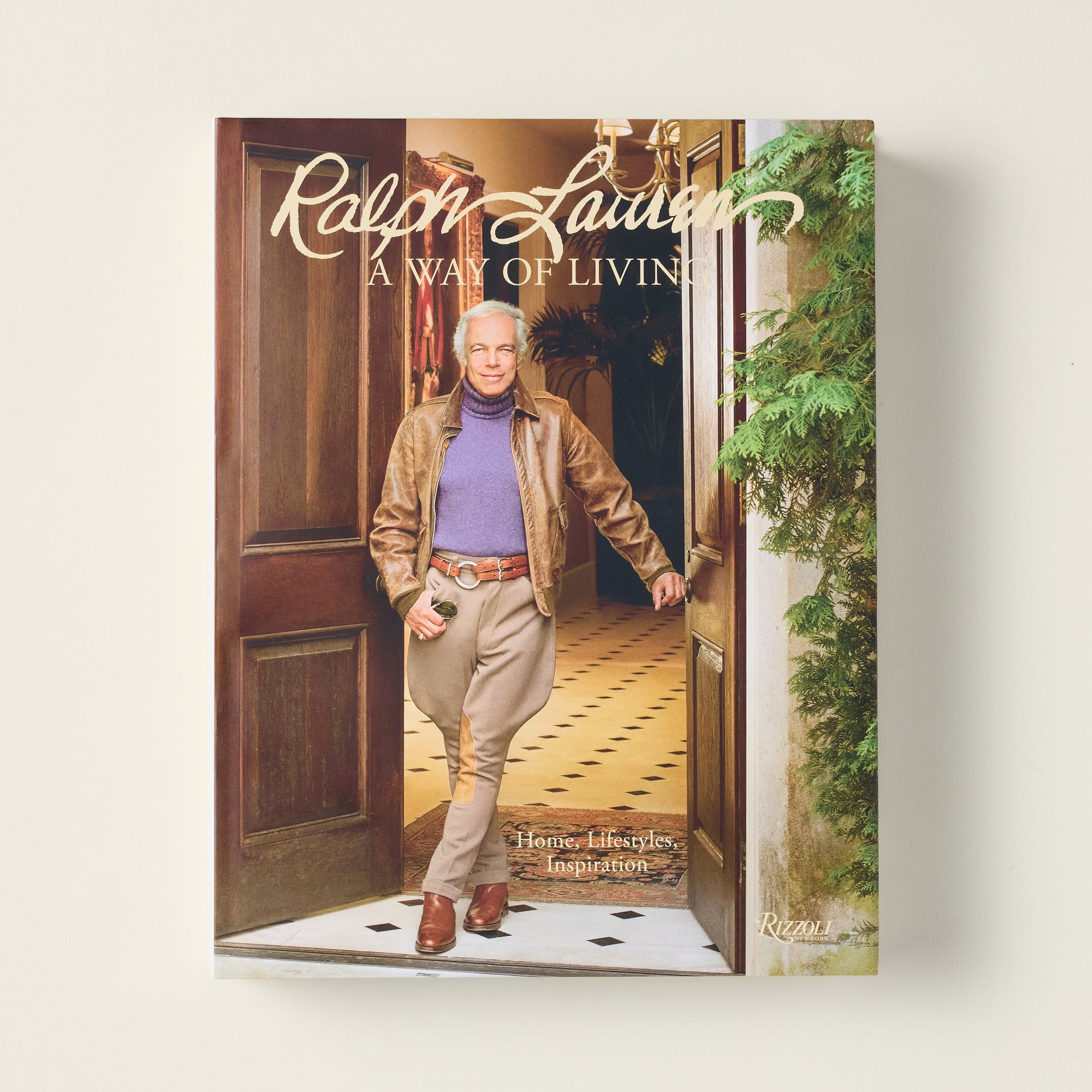 The cover of "Ralph Lauren: A Way of Living" book, featuring a classic, timeless photograph.