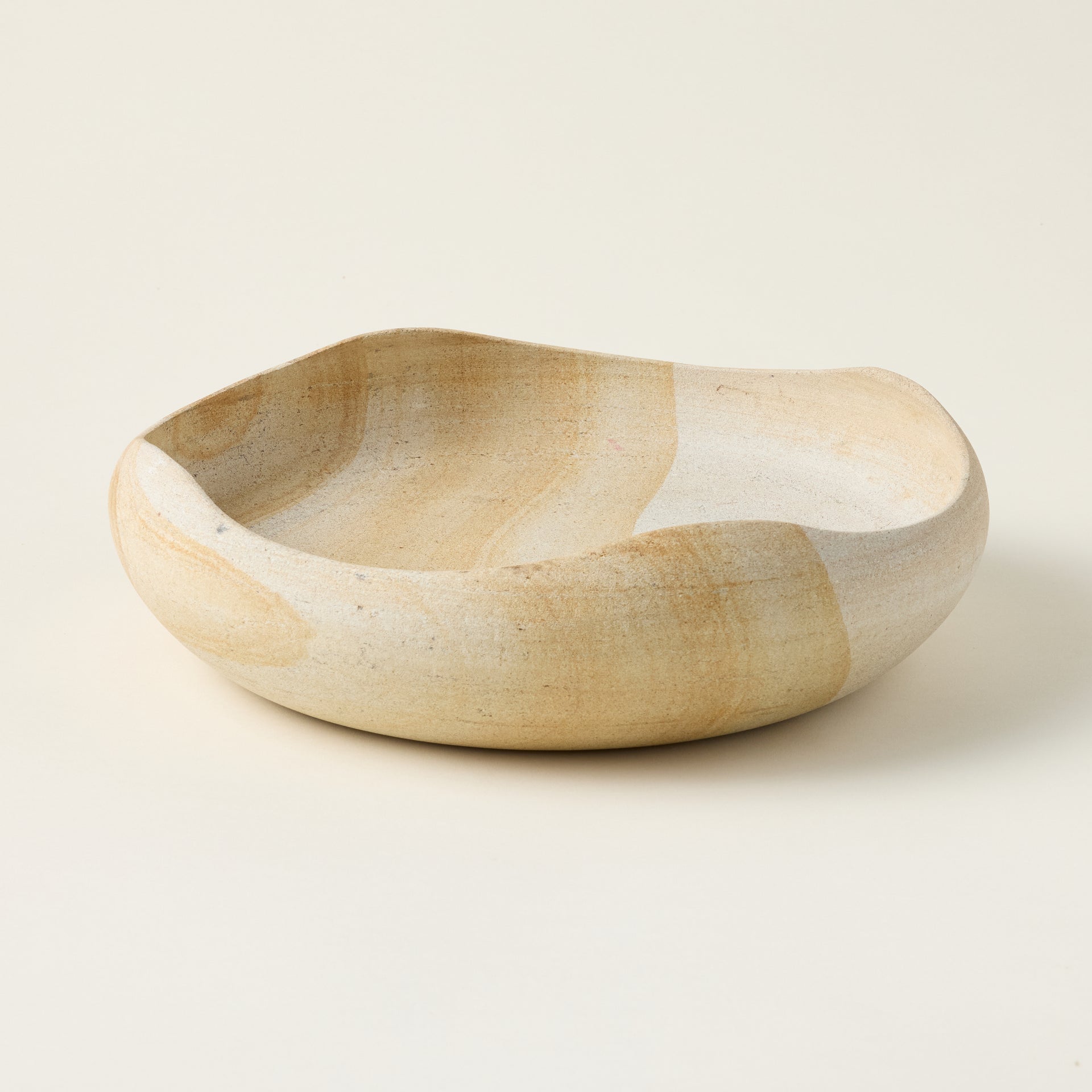 Sofia bowl crafted from natural Palimanan stone with an organic shape and a unique, distressed finish.