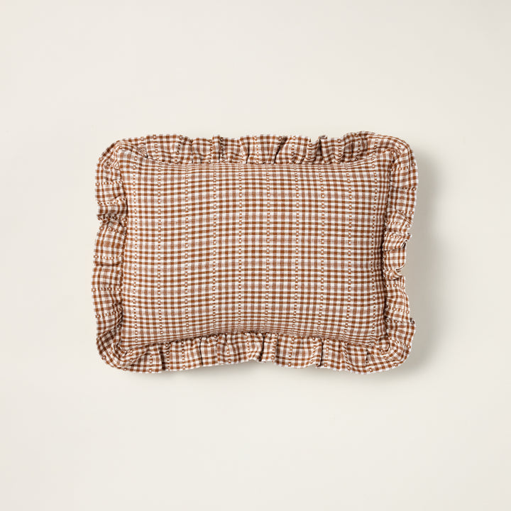Handwoven Soho Petite throw pillow with a nutmeg brown pattern and a decorative ruffle edge.