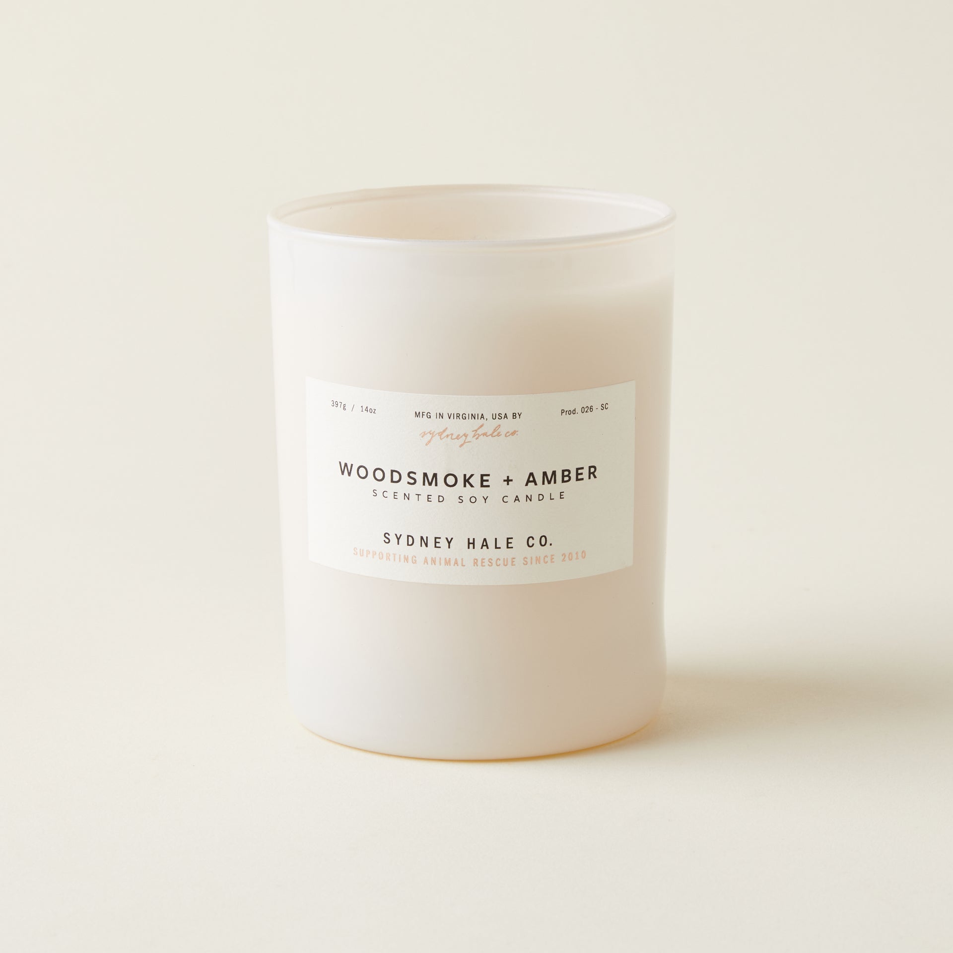 Sydney Hale Woodsmoke and Amber candle with a warm, comforting scent inspired by a distant fire.