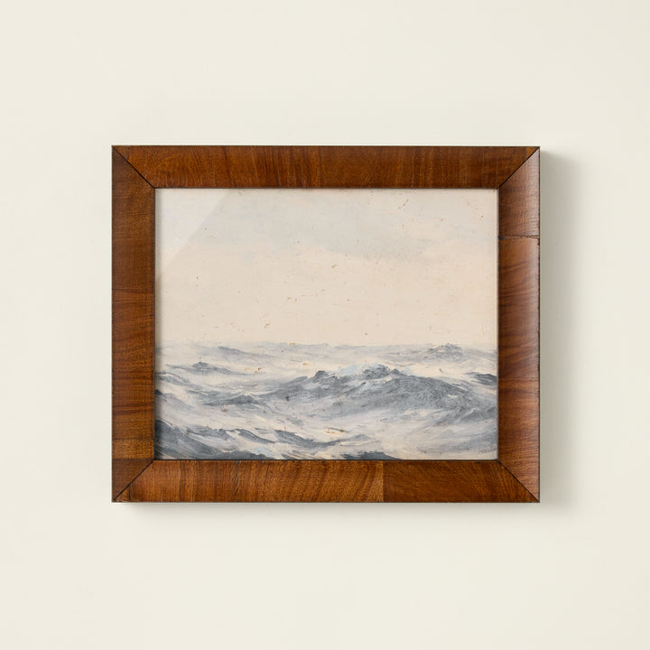 Vintage-inspired oil painting reproduction of ocean waves in a dark wooden frame.
