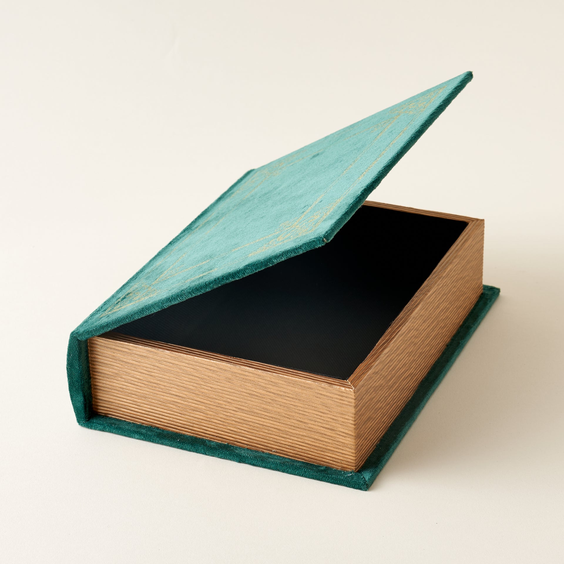 A decorative storage box with a vintage book-inspired design.