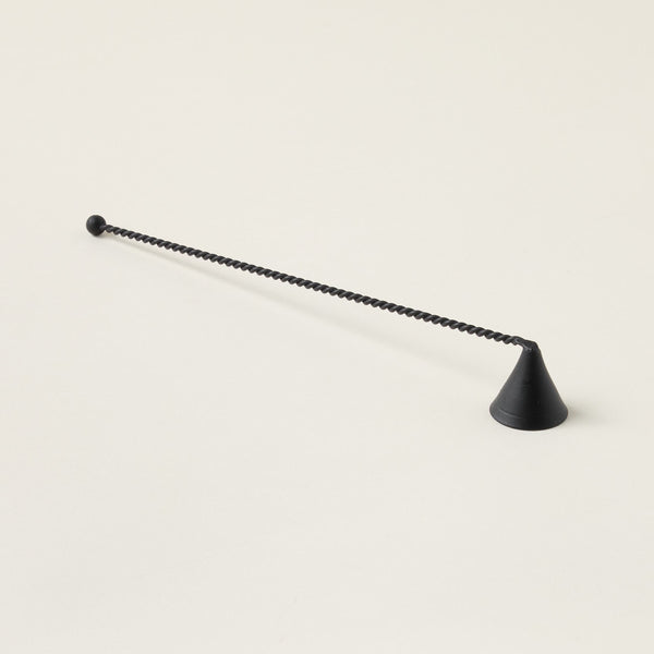 Artisan-inspired metal candle snuffer with a unique twisted handle and a modern design.