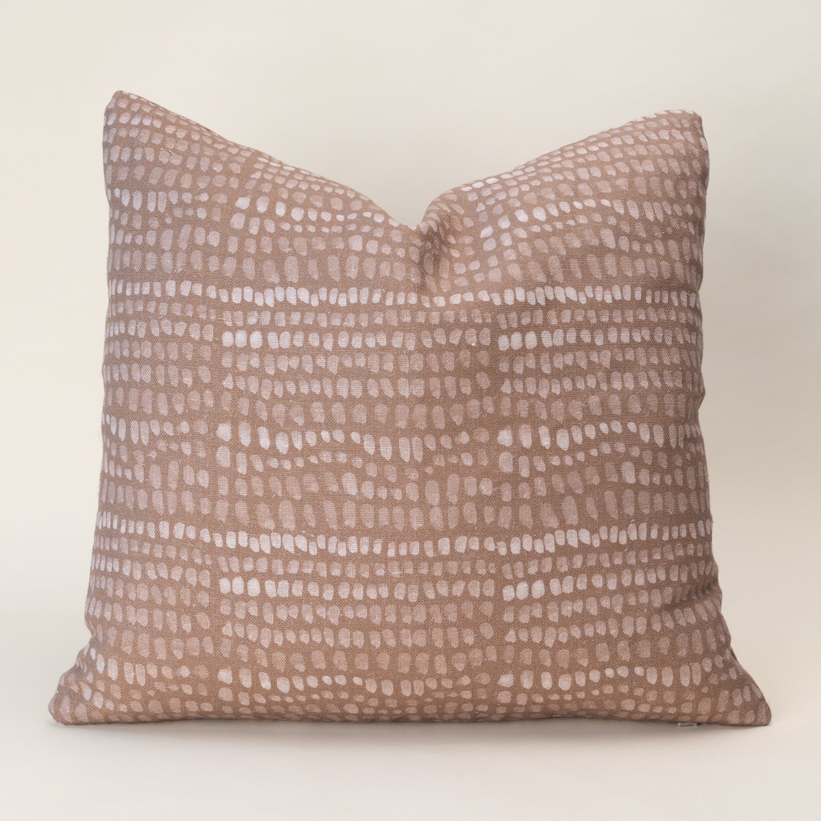 A double-sided pillow cover featuring an organic, nature-inspired motif on textured oatmeal linen fabric.