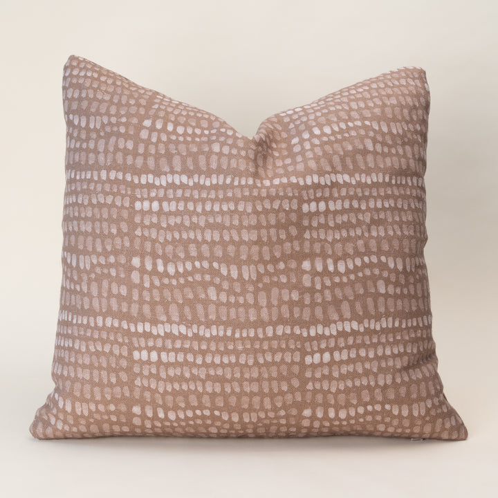 A double-sided pillow cover featuring an organic, nature-inspired motif on textured oatmeal linen fabric.