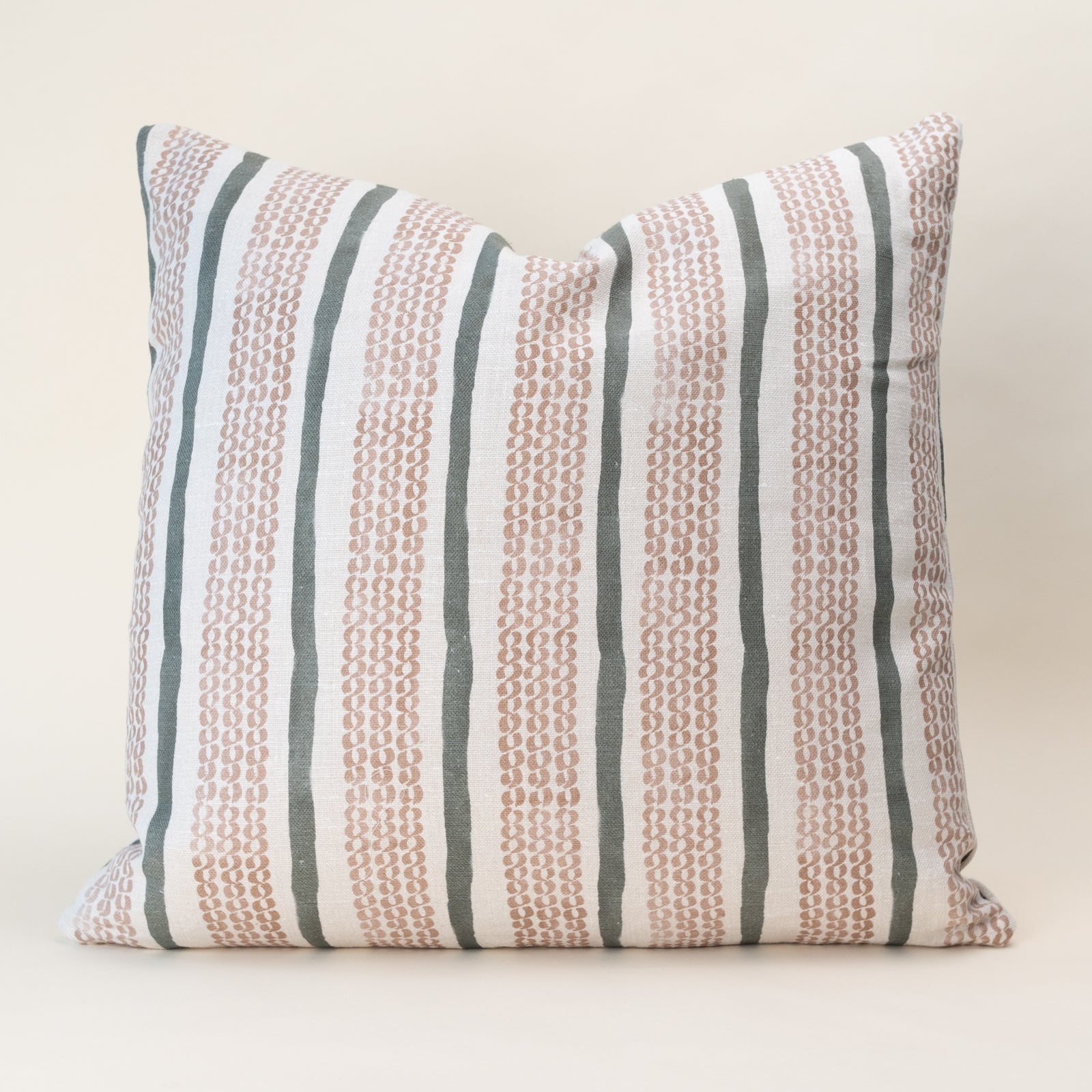 A double-sided, nature-inspired pillow cover in a soothing color, laid flat to show the organic motif pattern on oatmeal linen fabric.