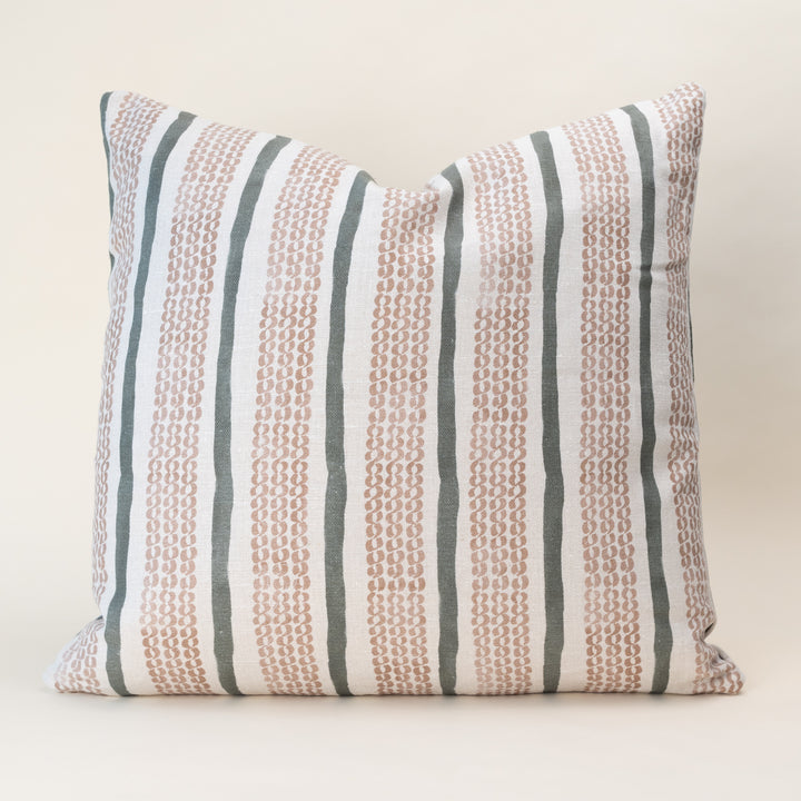 A double-sided, nature-inspired pillow cover in a soothing color, laid flat to show the organic motif pattern on oatmeal linen fabric.