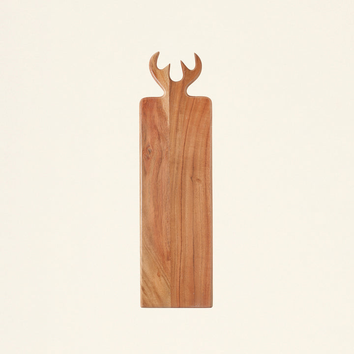 A serving board made of acacia wood with an antler-shaped handle.