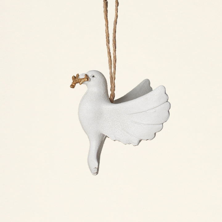 A decorative white resin dove ornament with a touch of glitter.