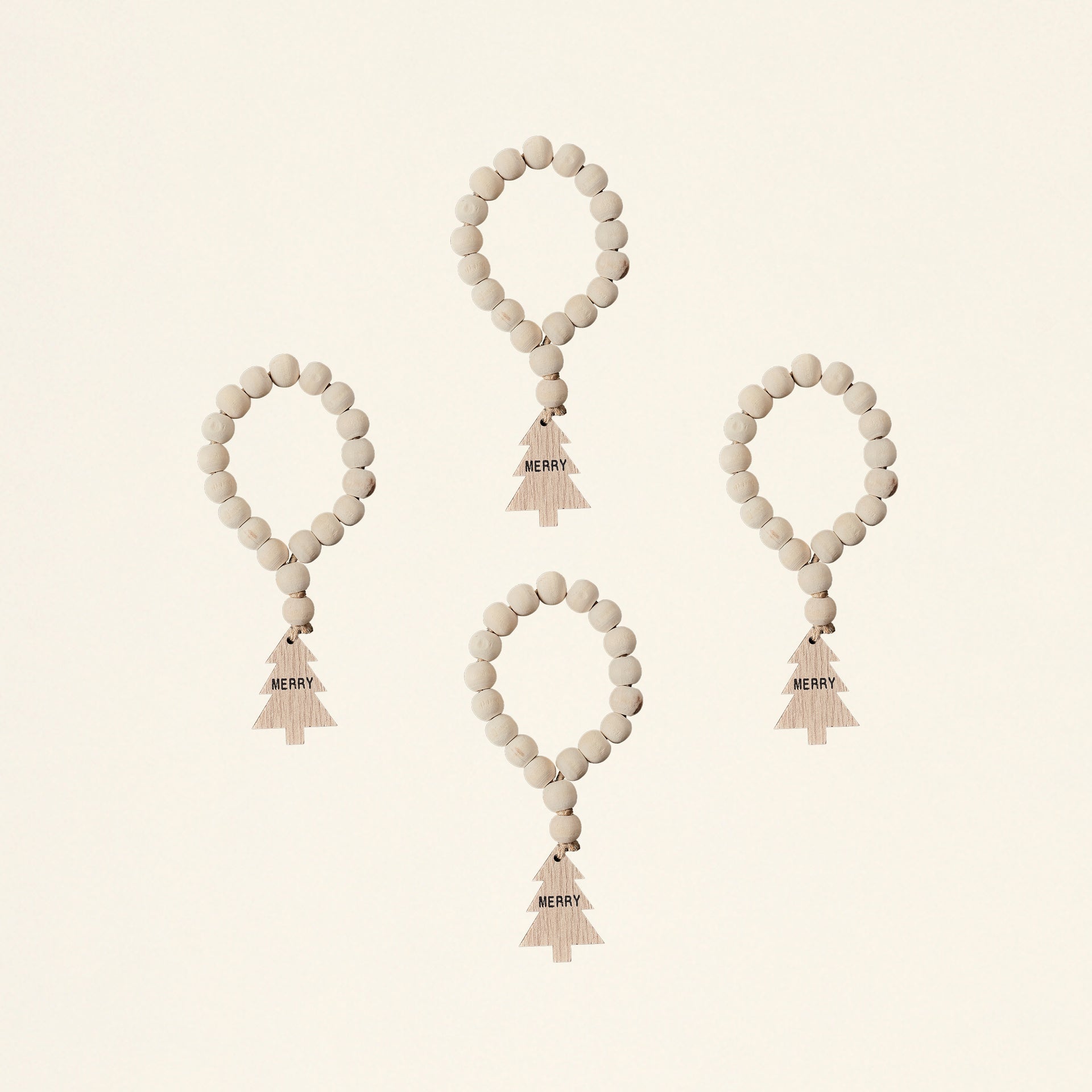 A set of four napkin rings made from wood bead garlands.