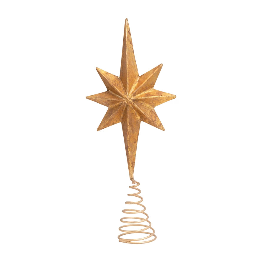 A decorative, antique gold-colored star-shaped tree topper made of paper mache.